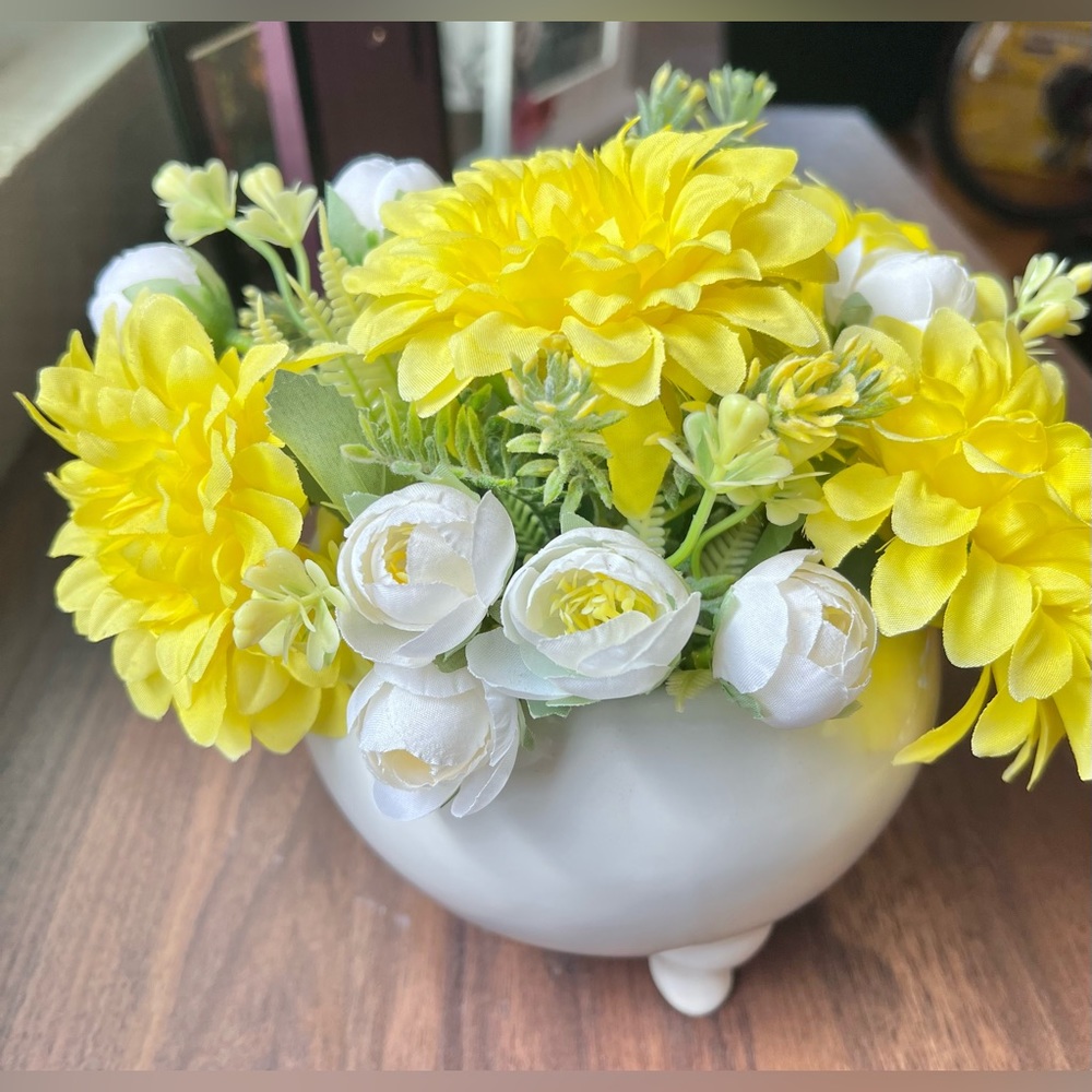 Faux flowers yellow and white in a cute ceramic white pot
